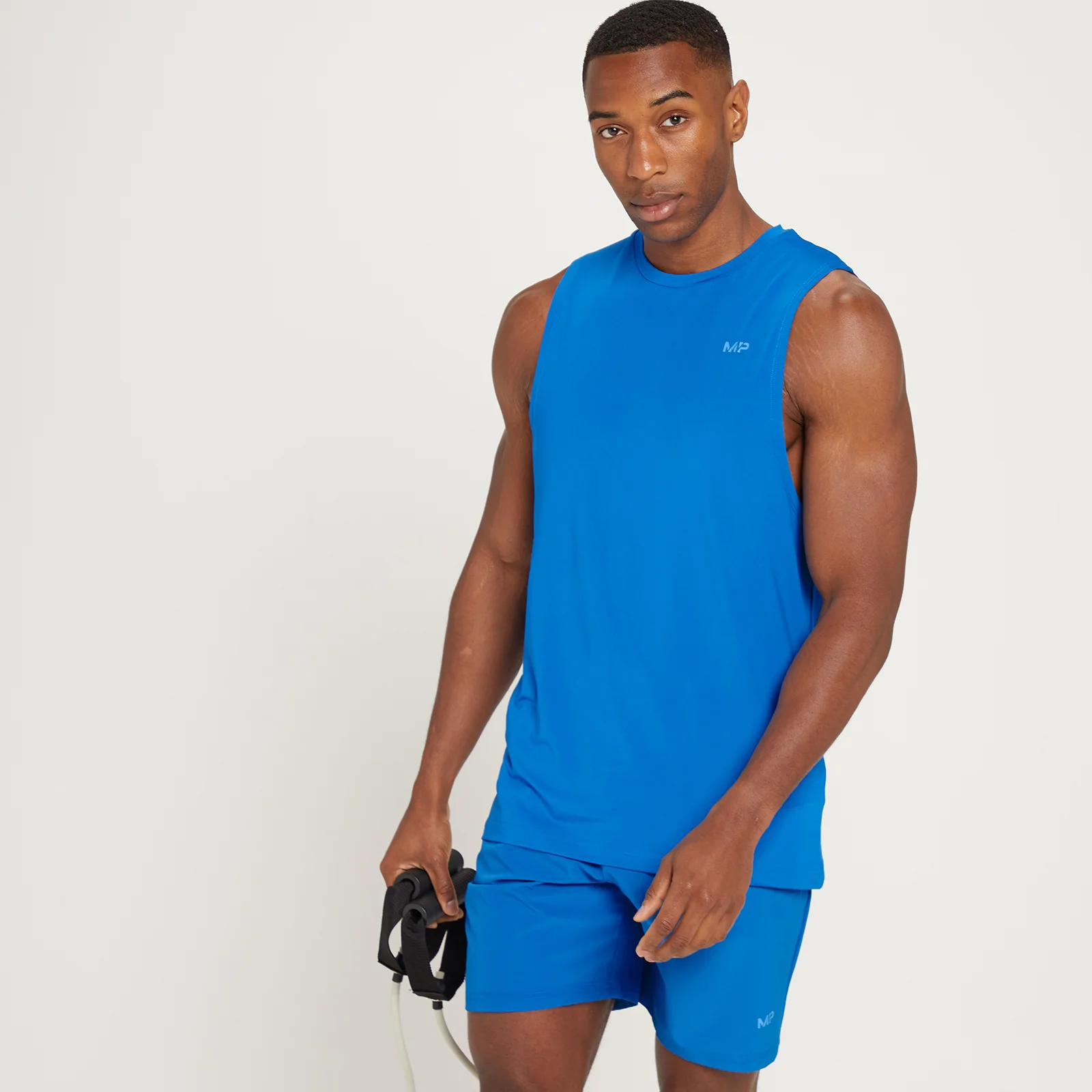 Camiseta sin mangas de entrenamiento con detalle gráfico Linear Mark para hombre de MP - Azul medio - XXS Imagen 1