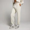 Pantalón deportivo extragrande con tobilleras para mujer de MP - Hueso