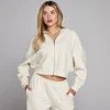 Sudadera con capucha y cremallera de gofre para mujer de MP - Marfil